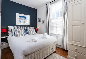 The bedrooms gorgeous nautical design reminds you just how close to the seaside you are!