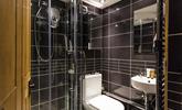 An additional shower room offers everyone extra space and privacy to get ready. - Thumbnail Image