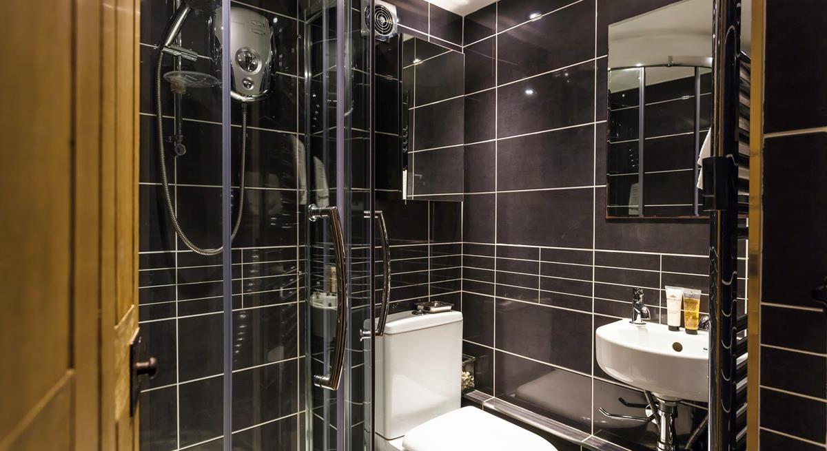 An additional shower room offers everyone extra space and privacy to get ready.