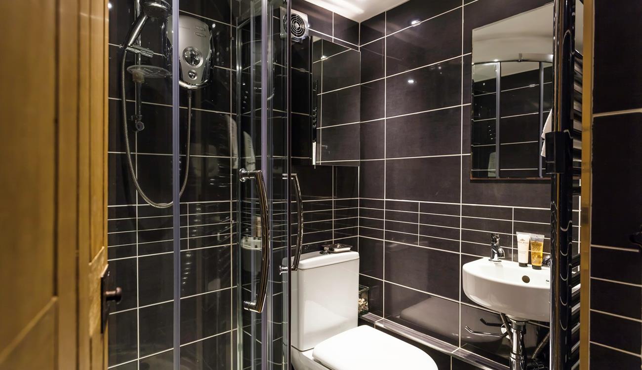 An additional shower room offers everyone extra space and privacy to get ready.