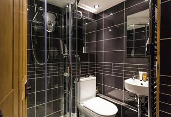 An additional shower room offers everyone extra space and privacy to get ready.