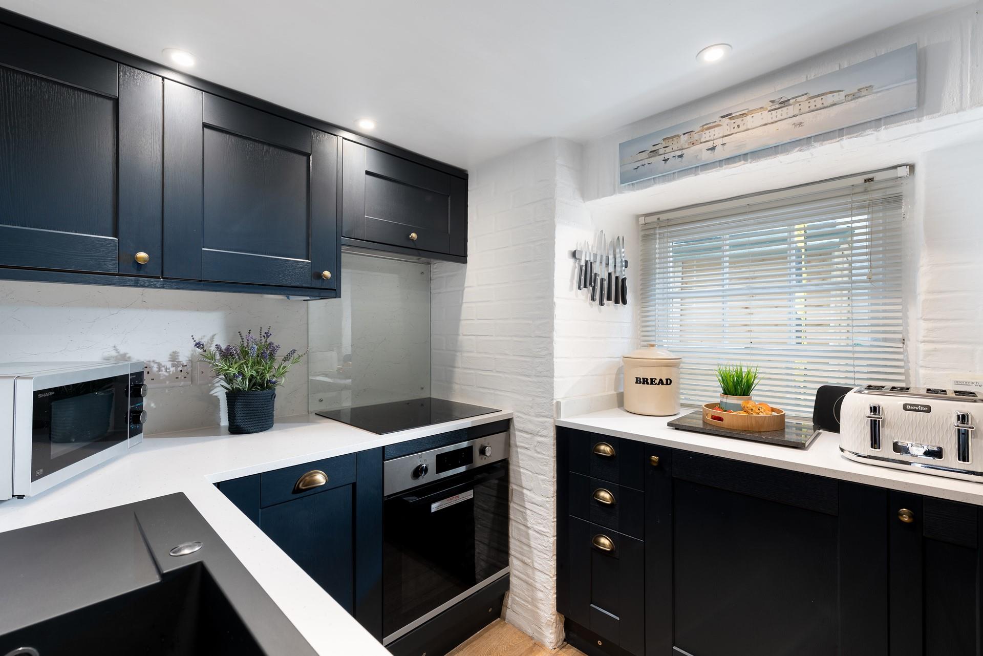 Though compact, the kitchen is fabulously well-equipped with all you could need and more.