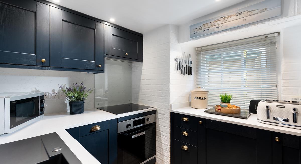 Though compact, the kitchen is fabulously well-equipped with all you could need and more.