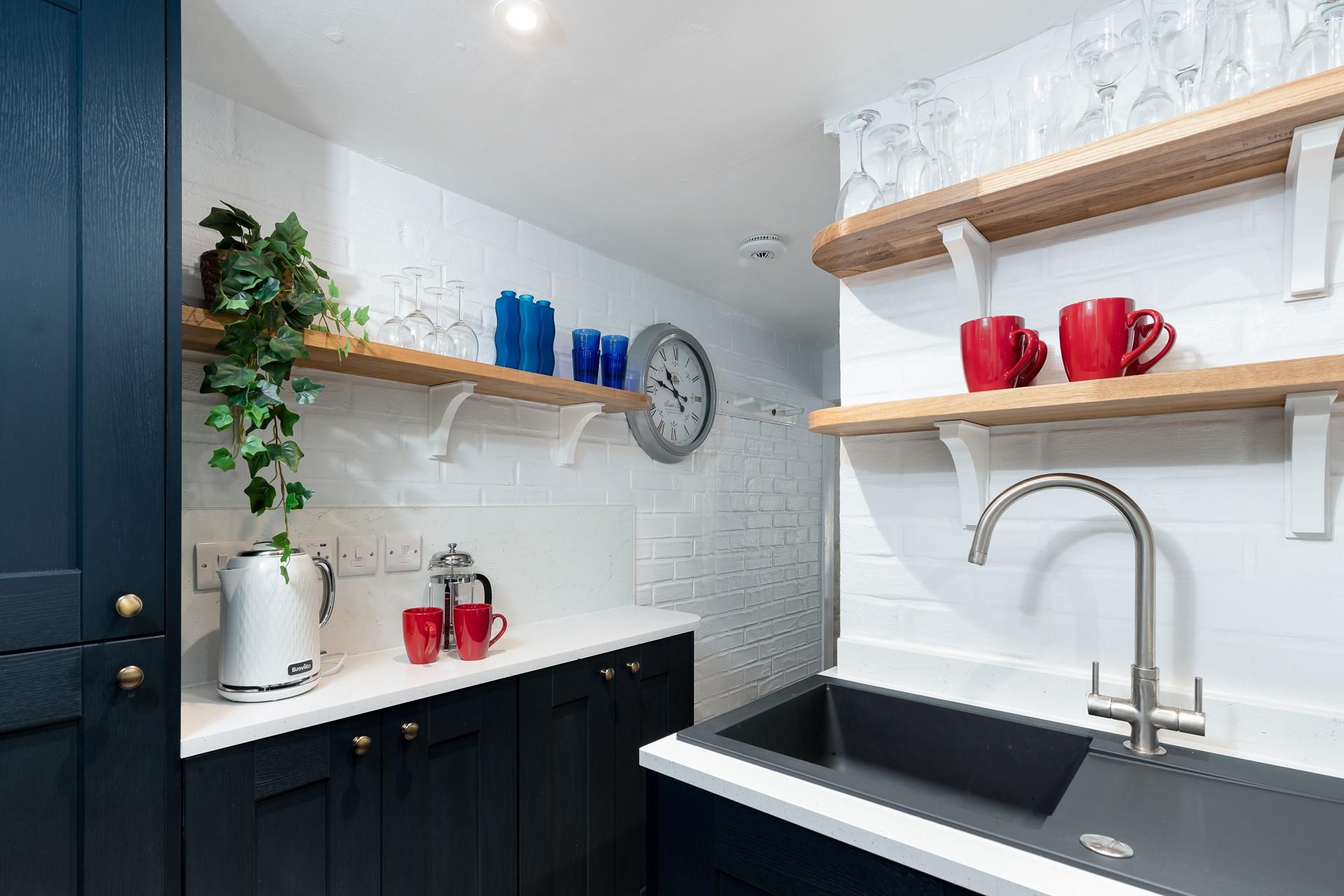 The modern appliances and an array of kitchen utensils are sure to delight any budding chefs. 