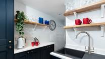 The modern appliances and an array of kitchen utensils are sure to delight any budding chefs. 