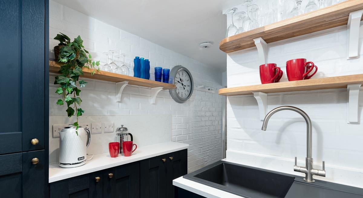 The modern appliances and an array of kitchen utensils are sure to delight any budding chefs. 