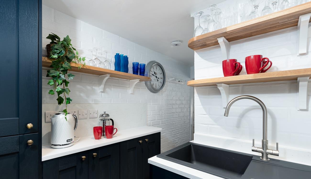 The modern appliances and an array of kitchen utensils are sure to delight any budding chefs. 