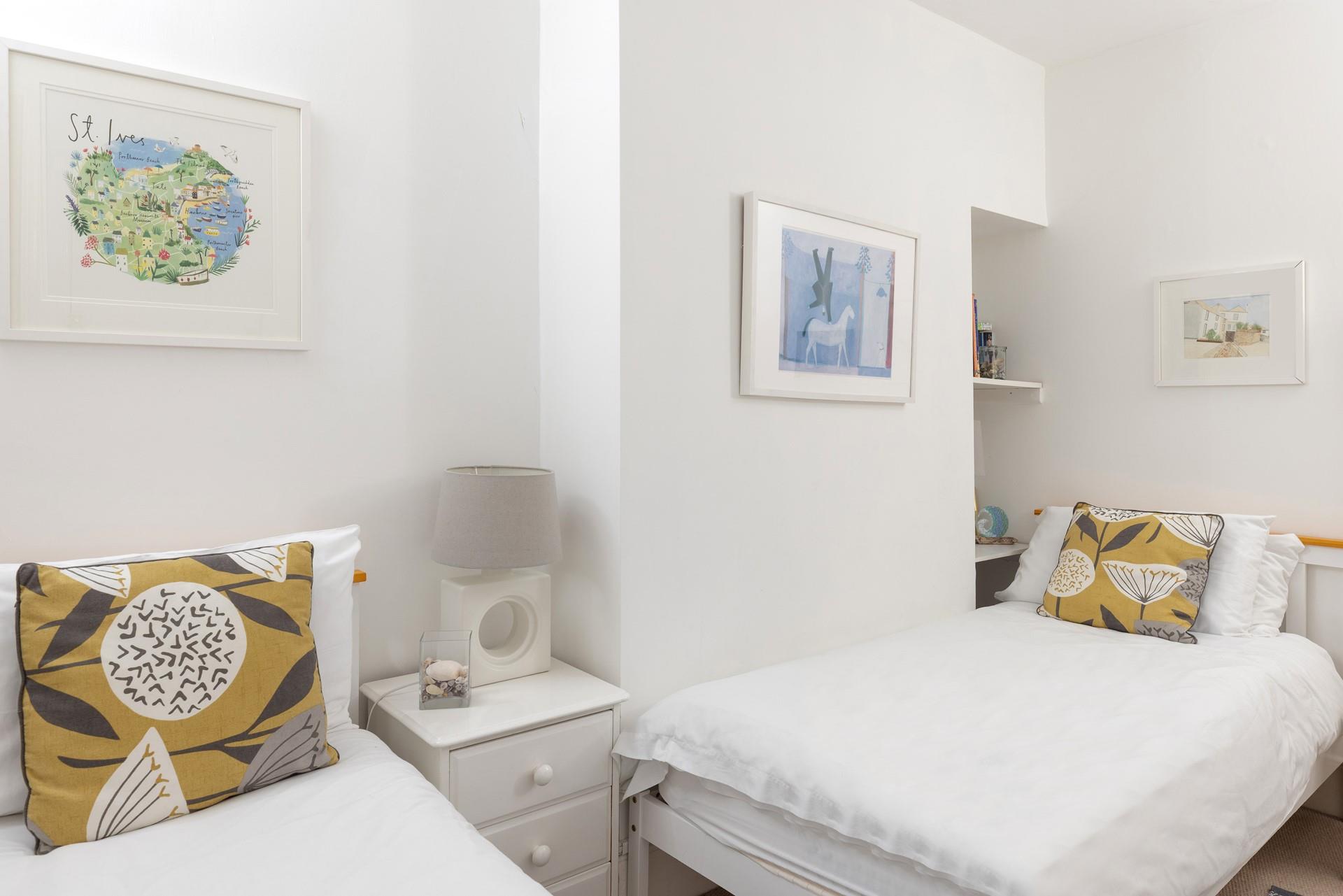 Calming hues and crisp white linen have created a light and inviting room.