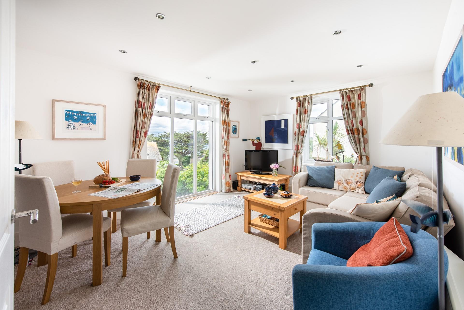 Soft seaside colours and classic furniture have created a snug, homely feel.