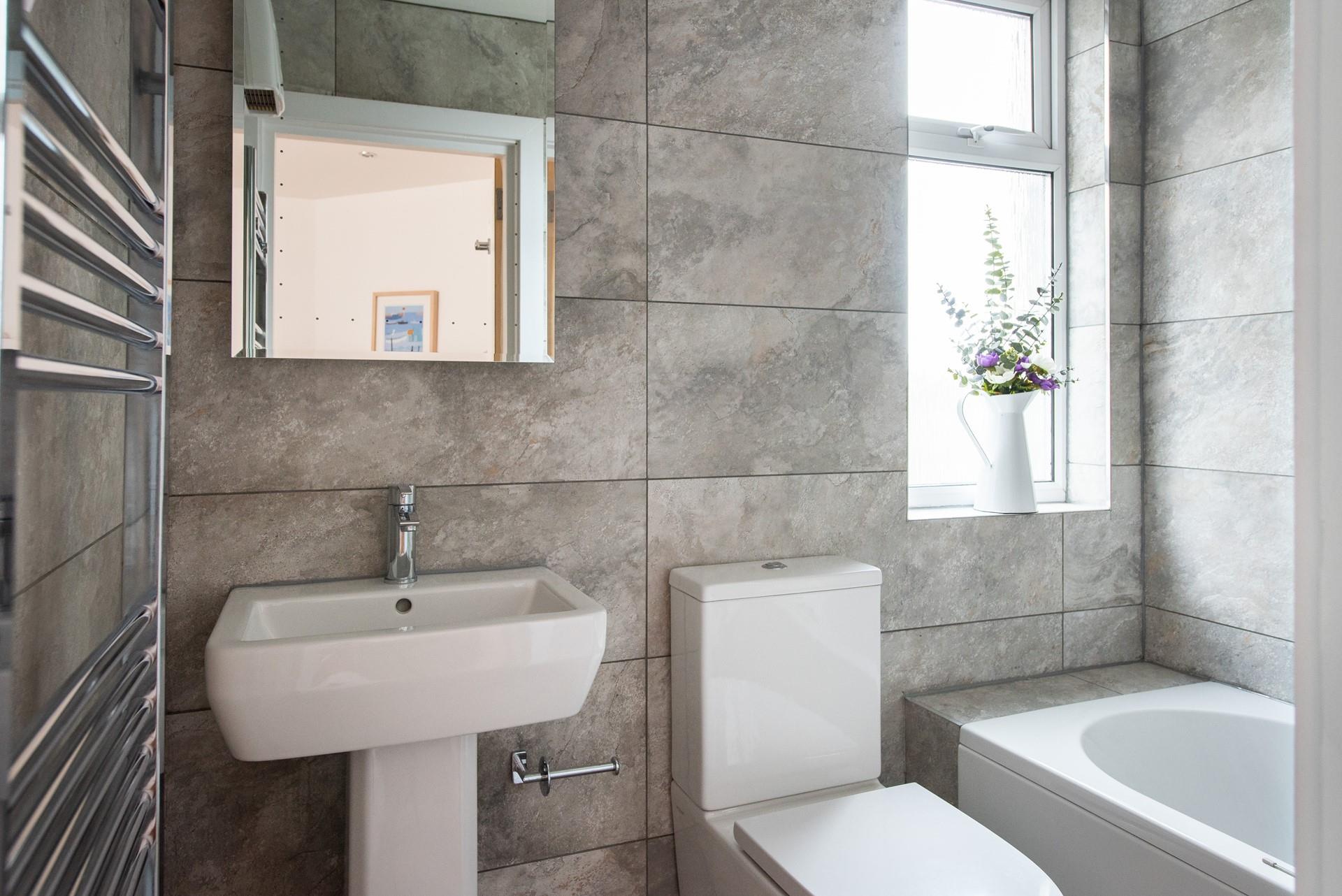 The gorgeous bathroom has been beautifully designed, giving it a luxurious feel.