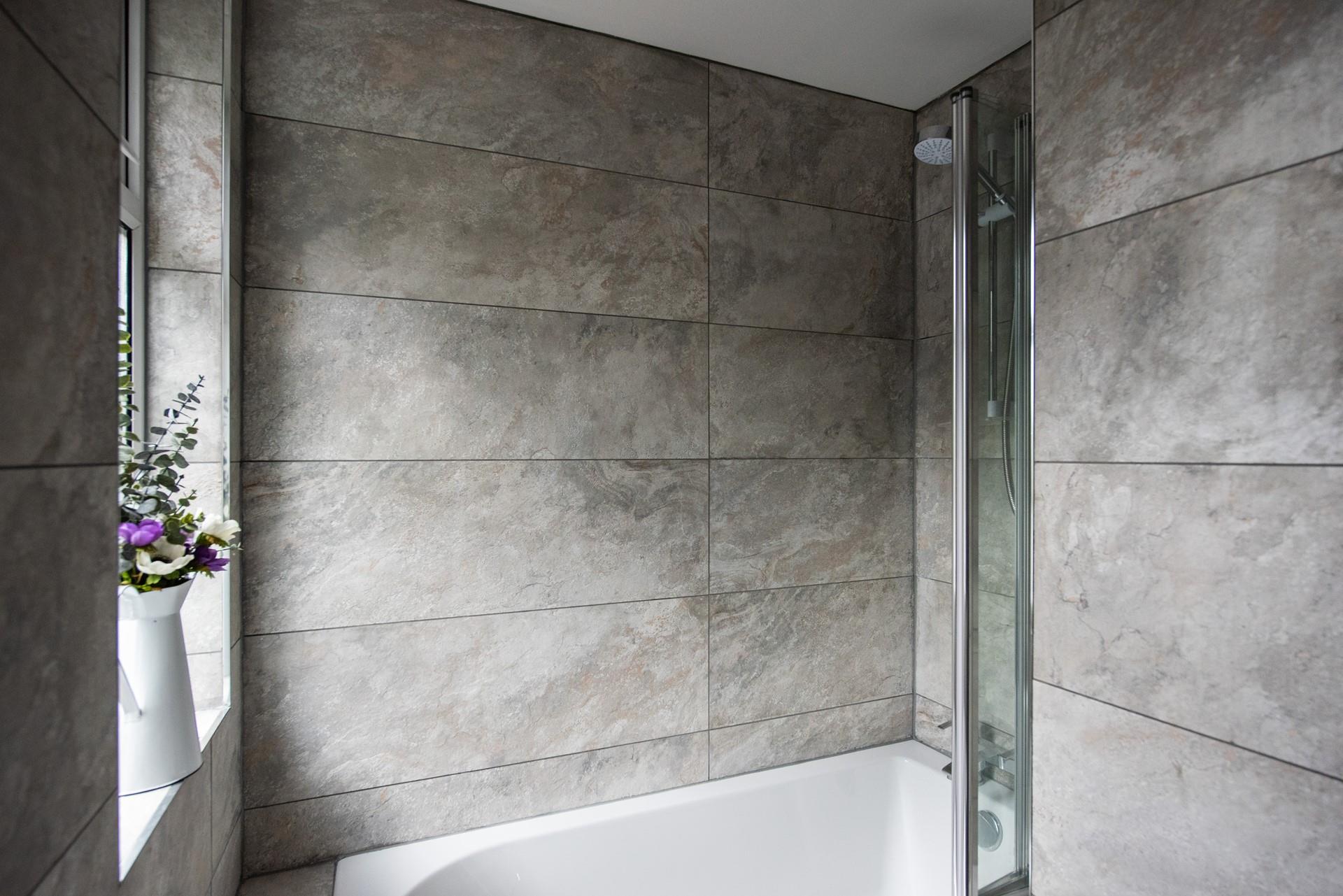Marble tiles in calming tones are perfect for helping you to unwind in the bath.