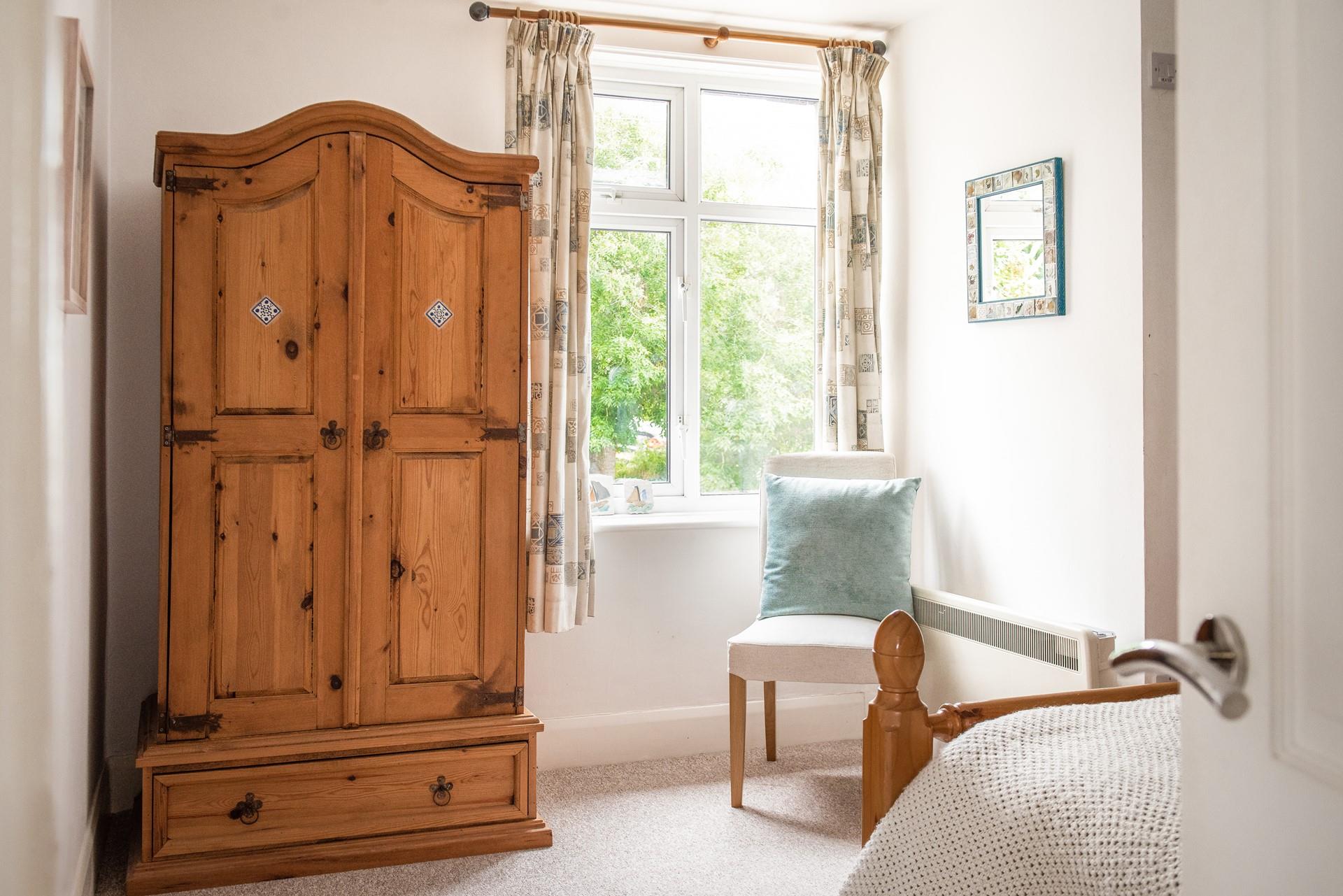 The large wardrobe offers ample storage for all your holiday best.