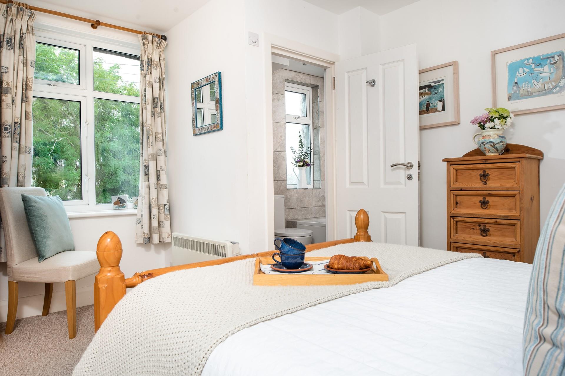 The charming bedroom with its spacious double bed looks as though it is straight out of a fairytale.