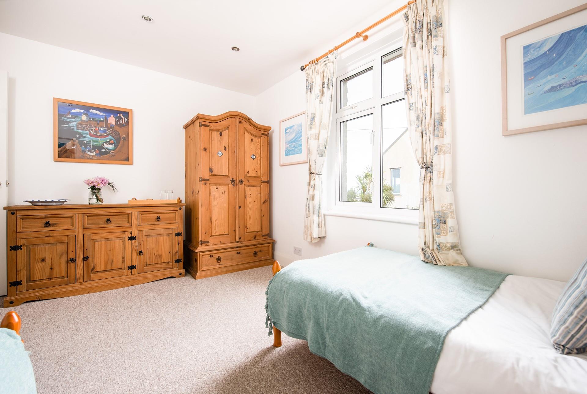 The spacious twin bedroom is perfect for both children or friends sharing.