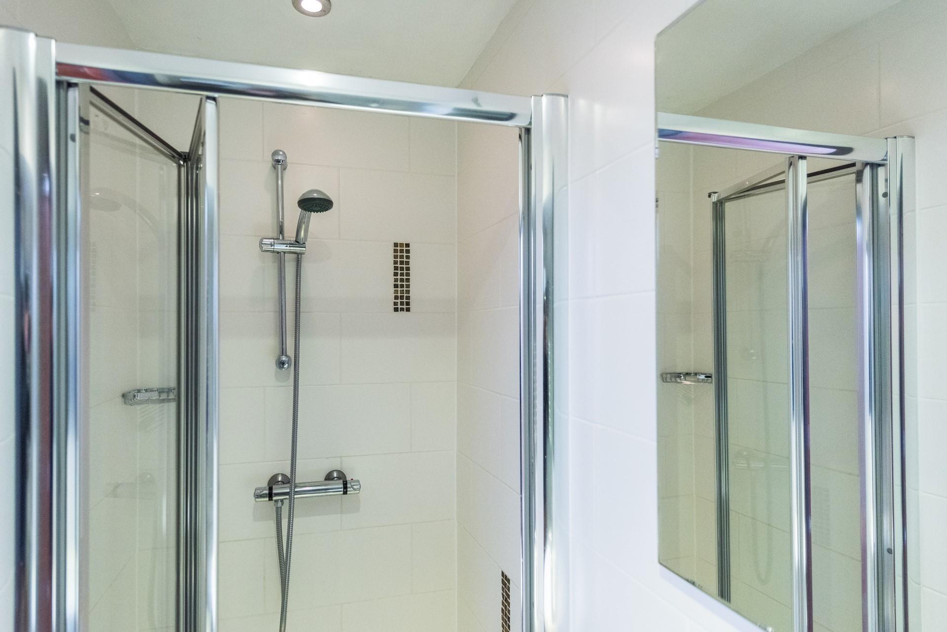 The spacious ensuite has a large enclosed shower.