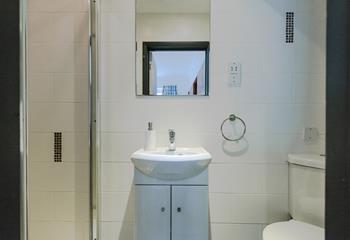Bright and perfectly sized, the ensuite has an enclosed shower, WC and wash basin. 