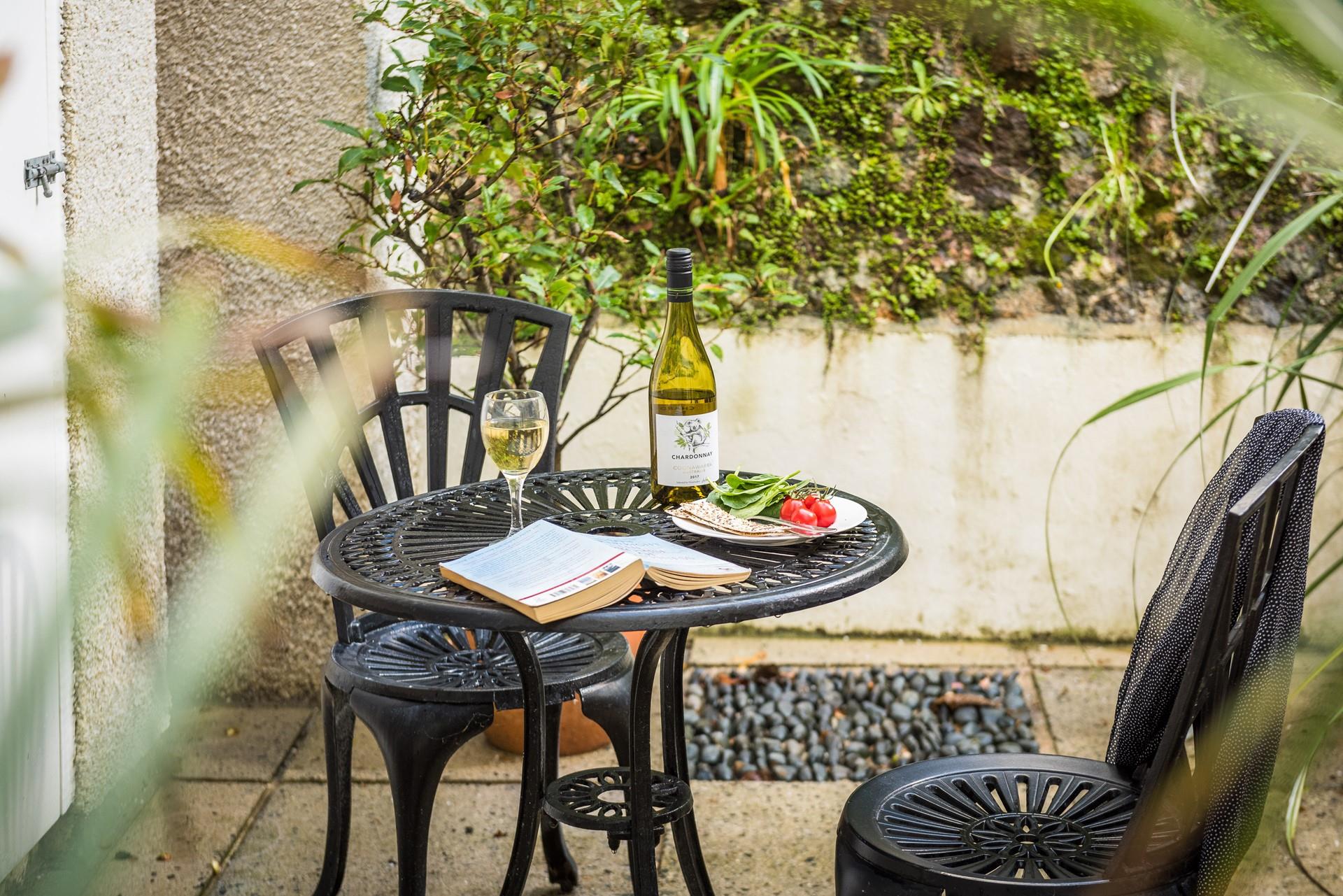 Dine outside at the bistro table and chairs on the private patio. 