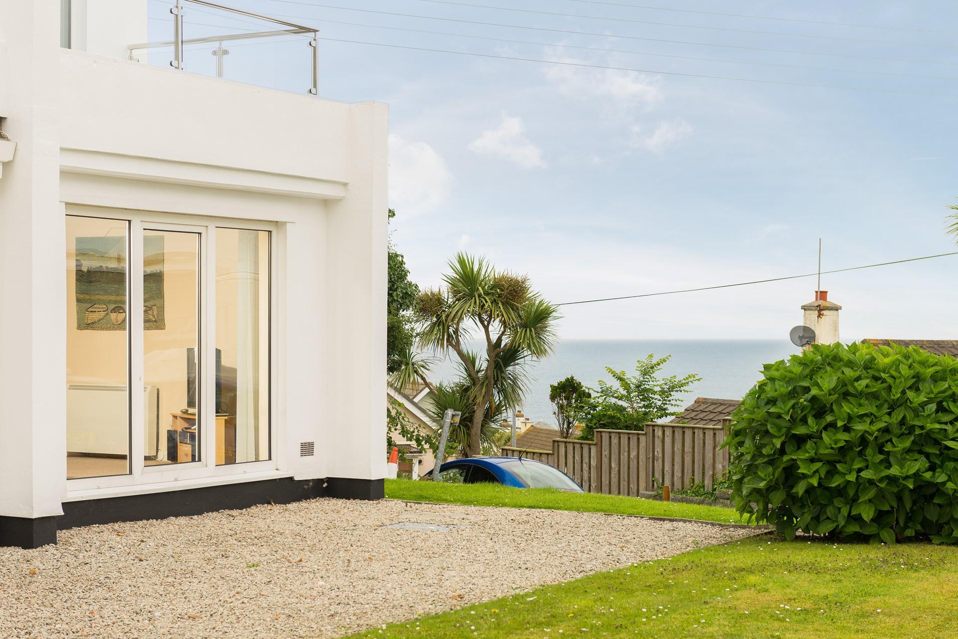 Large patio doors open up to allow in the fresh Cornish air and the sound of the sea in the distance.
