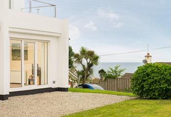 Large patio doors open up to allow in the fresh Cornish air and the sound of the sea in the distance.