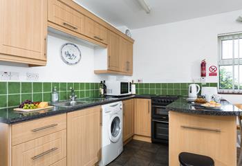 Modern appliances in the country-style kitchen make cooking up a feast an absolute breeze.