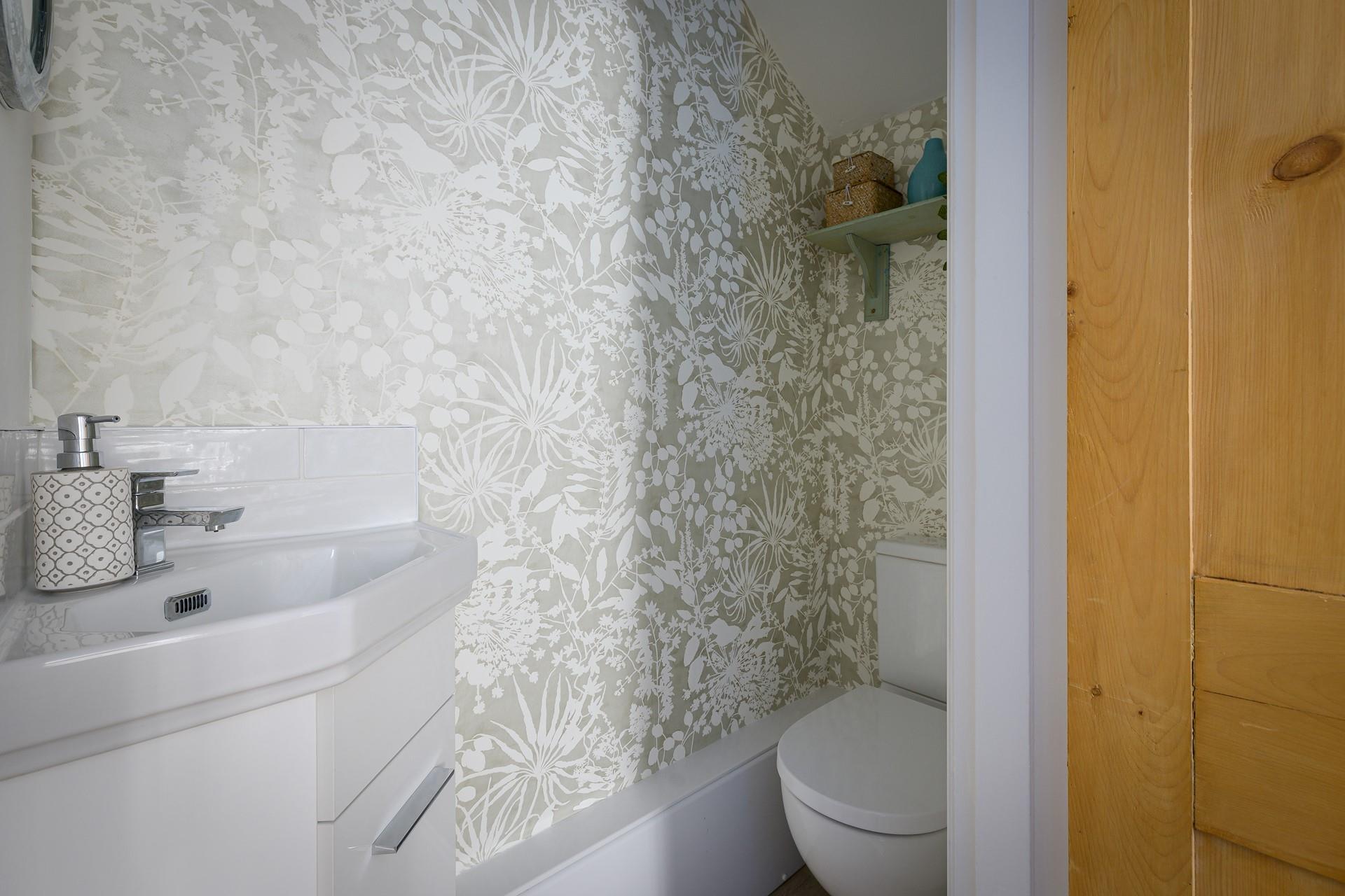 The cloakroom has a WC and basin.