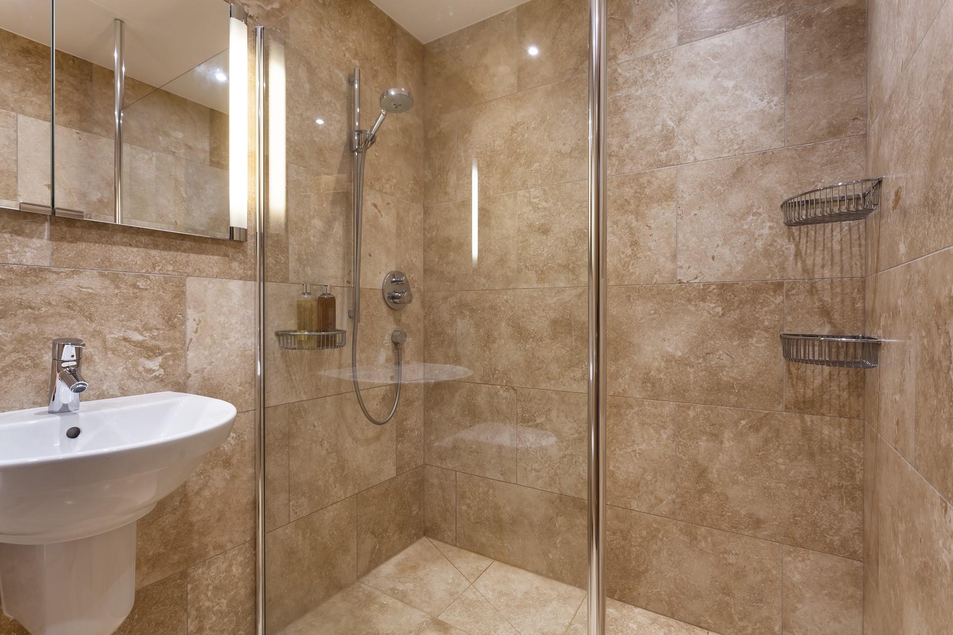 Wash off sandy toes in the shower after a day on Porthmeor Beach.