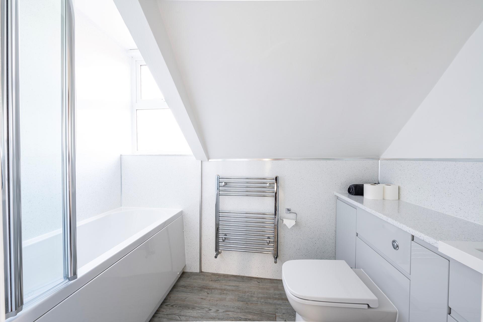 The en suite in the main bedroom is spacious and has a high quality finish. 