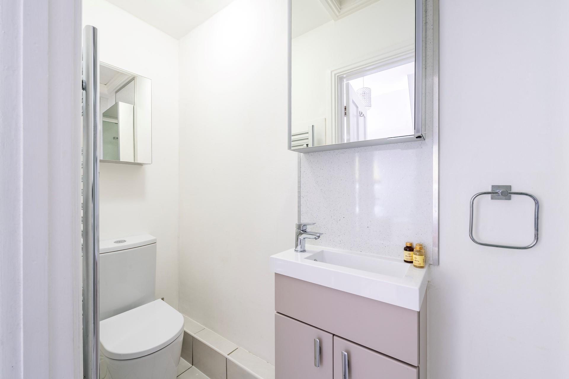 Beautifully finished, the en suite is modern and features storage space for all your toiletries. 