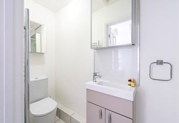 Beautifully finished, the en suite is modern and features storage space for all your toiletries. 