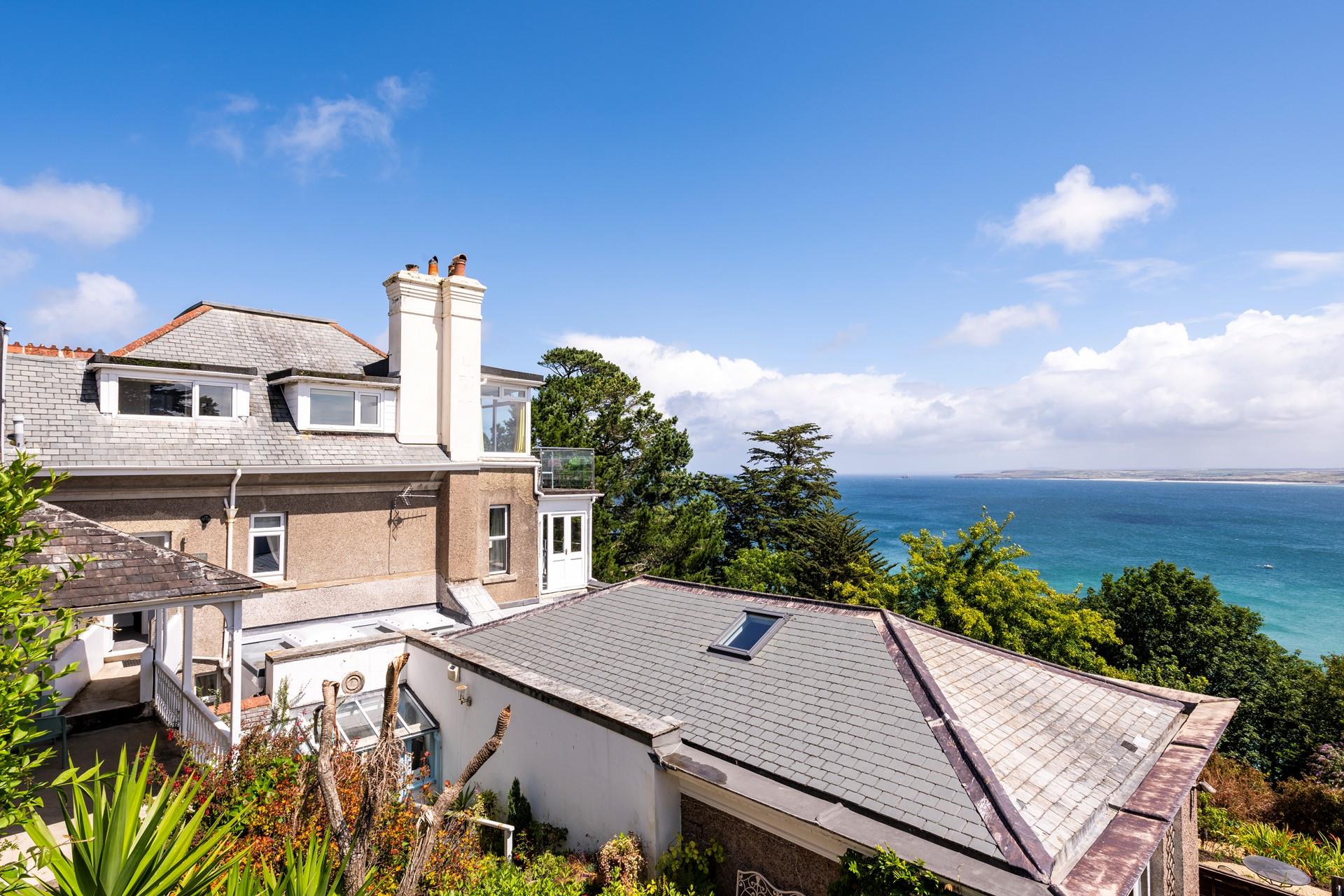 Treetops and turquoise waters make the perfect backdrop for an evening drink.