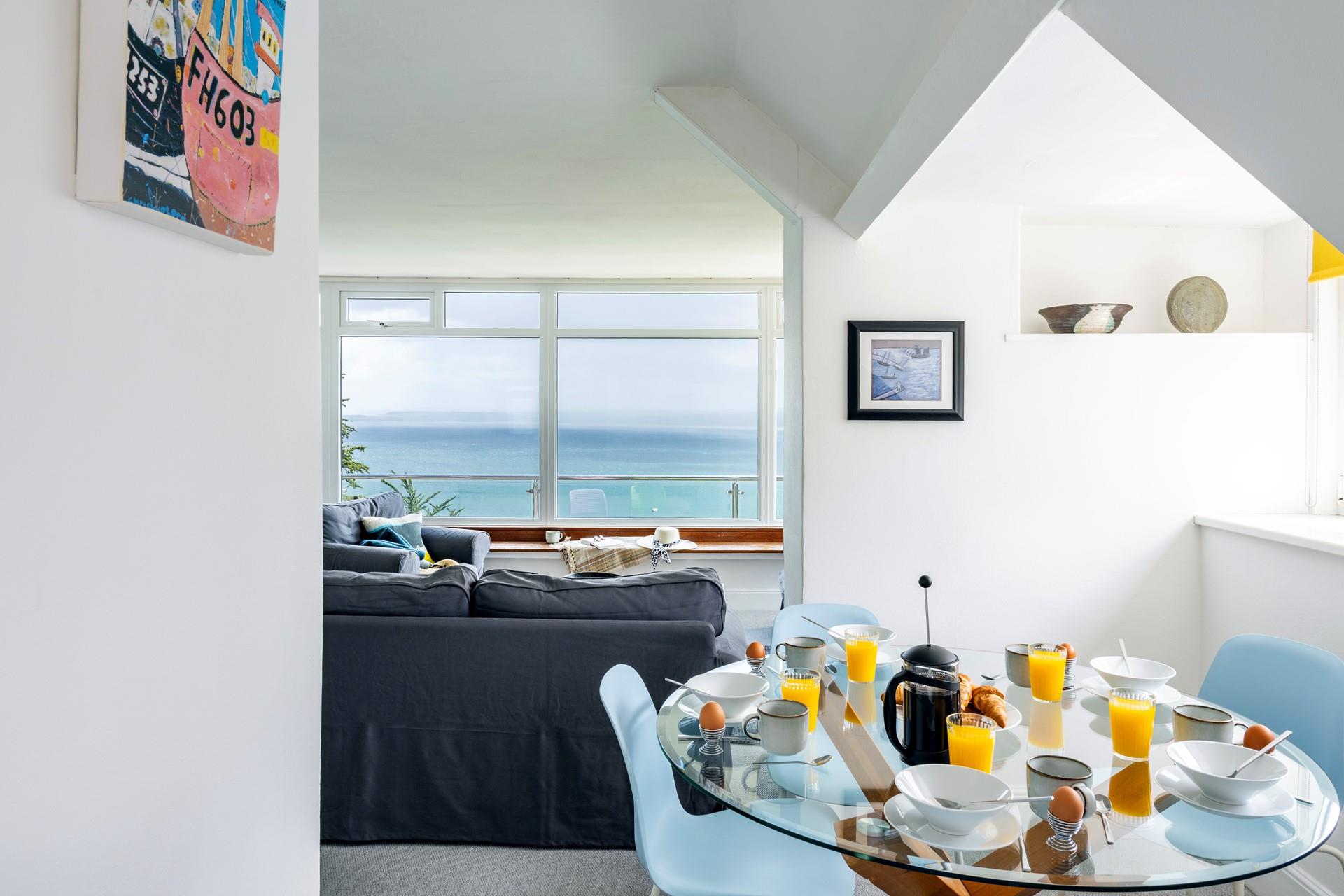 We love the stylish glass table and pastel blue chairs. 