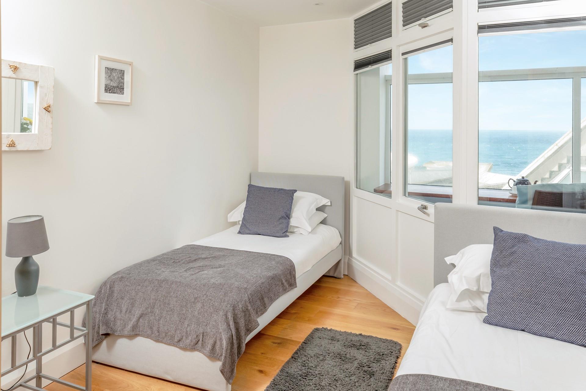 The twin bedroom boasts stunning sea views.