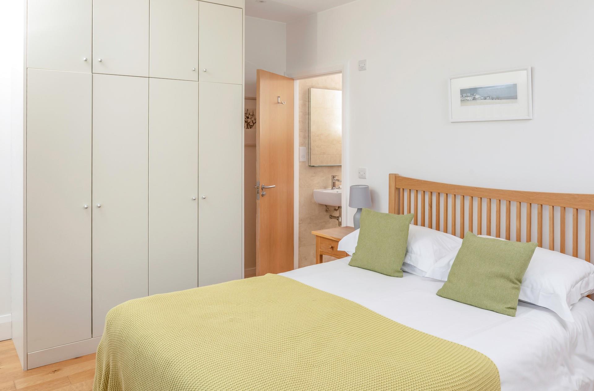 Bedroom 1 has plenty of wardrobe space and an en suite shower.