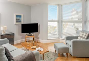 After a day exploring the coast path, relax in the cosy living area.