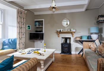 The cosy sitting room offers the perfect base to come back to after a day on the beach.