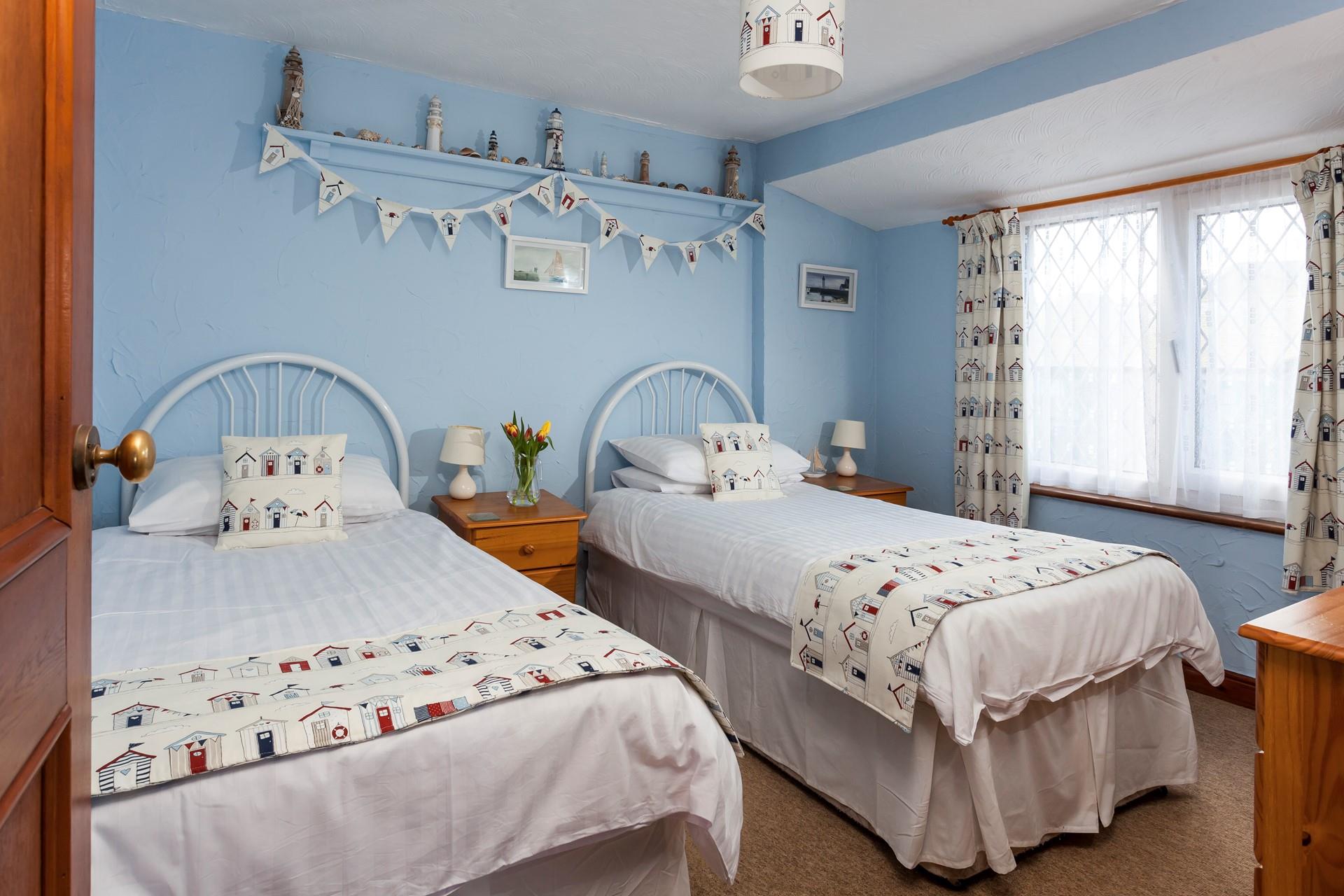 Bedroom 2 is the twin room on the first floor and it is at the rear of Island Cottage. 