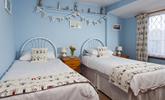 Bedroom 2 has seaside decor reflecting the cottage's close proximity to the sea. - Thumbnail Image