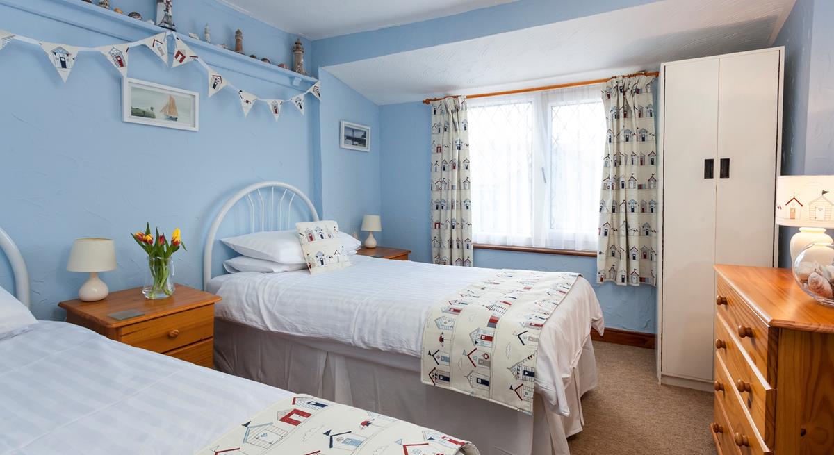 There is a handy chest of drawers and a wardrobe for all your holiday clothes.