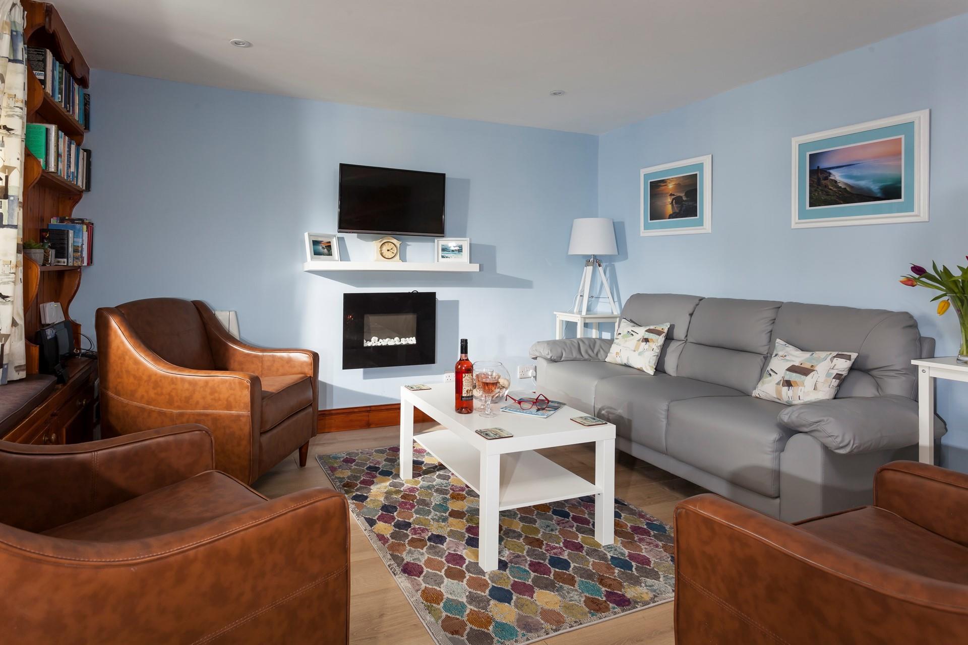 After spending the day on Porthmeor beach, come back to the cosy sitting room to open a bottle of wine.