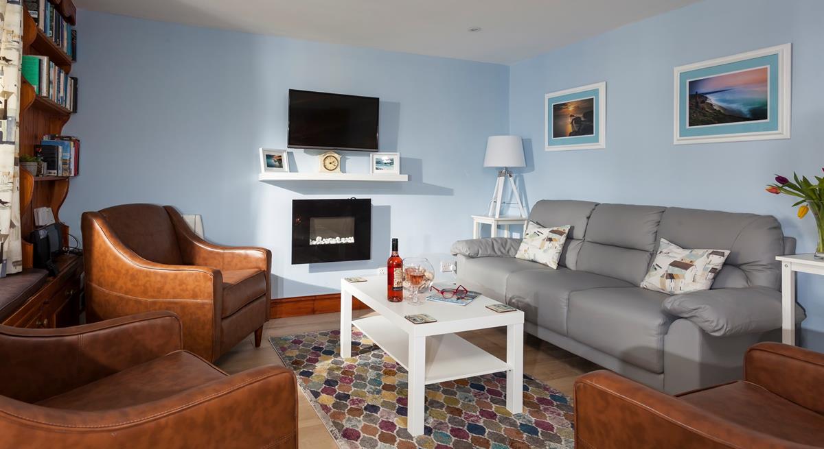 After spending the day on Porthmeor beach, come back to the cosy sitting room to open a bottle of wine.