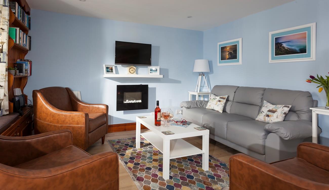 After spending the day on Porthmeor beach, come back to the cosy sitting room to open a bottle of wine.