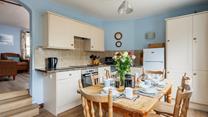The roomy kitchen/dining area is located at the back of the property.
