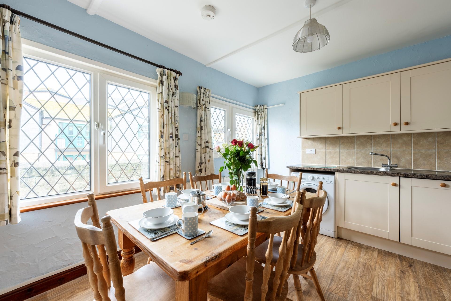 Enjoy dining around the farmhouse style table with seating for six.