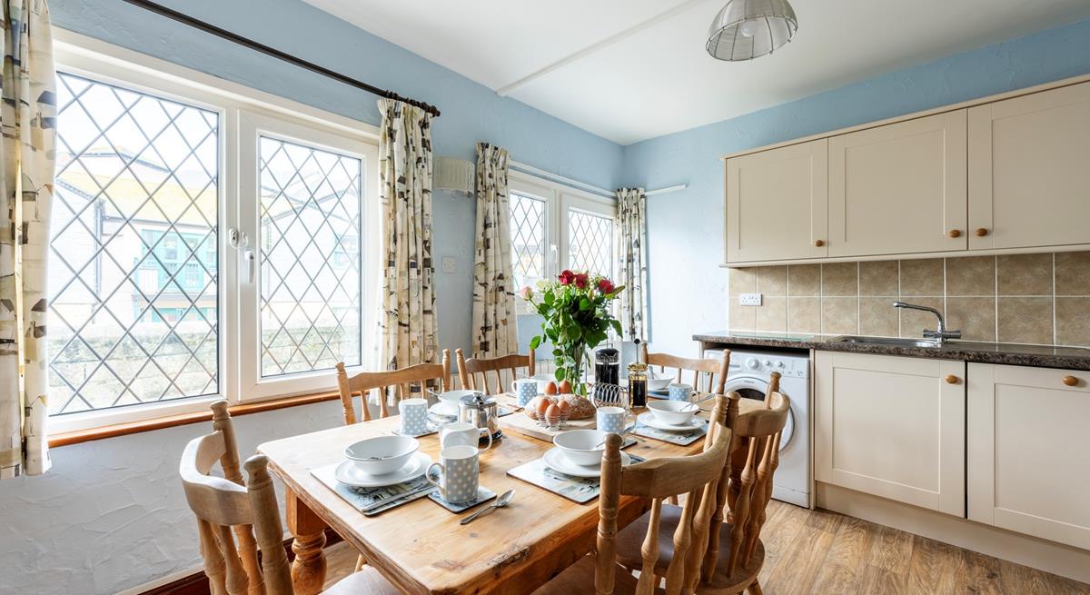 Enjoy dining around the farmhouse style table with seating for six.