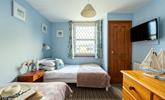Bedroom 3 has a nautical and blue theme and is a cosy space for 2 people. - Thumbnail Image