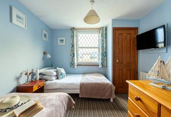 Bedroom 3 has a nautical and blue theme and is a cosy space for 2 people.