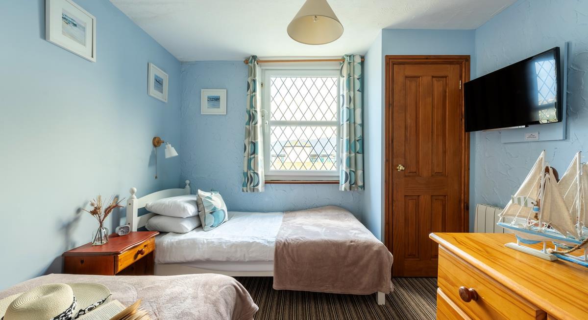 Bedroom 3 has a nautical and blue theme and is a cosy space for 2 people.