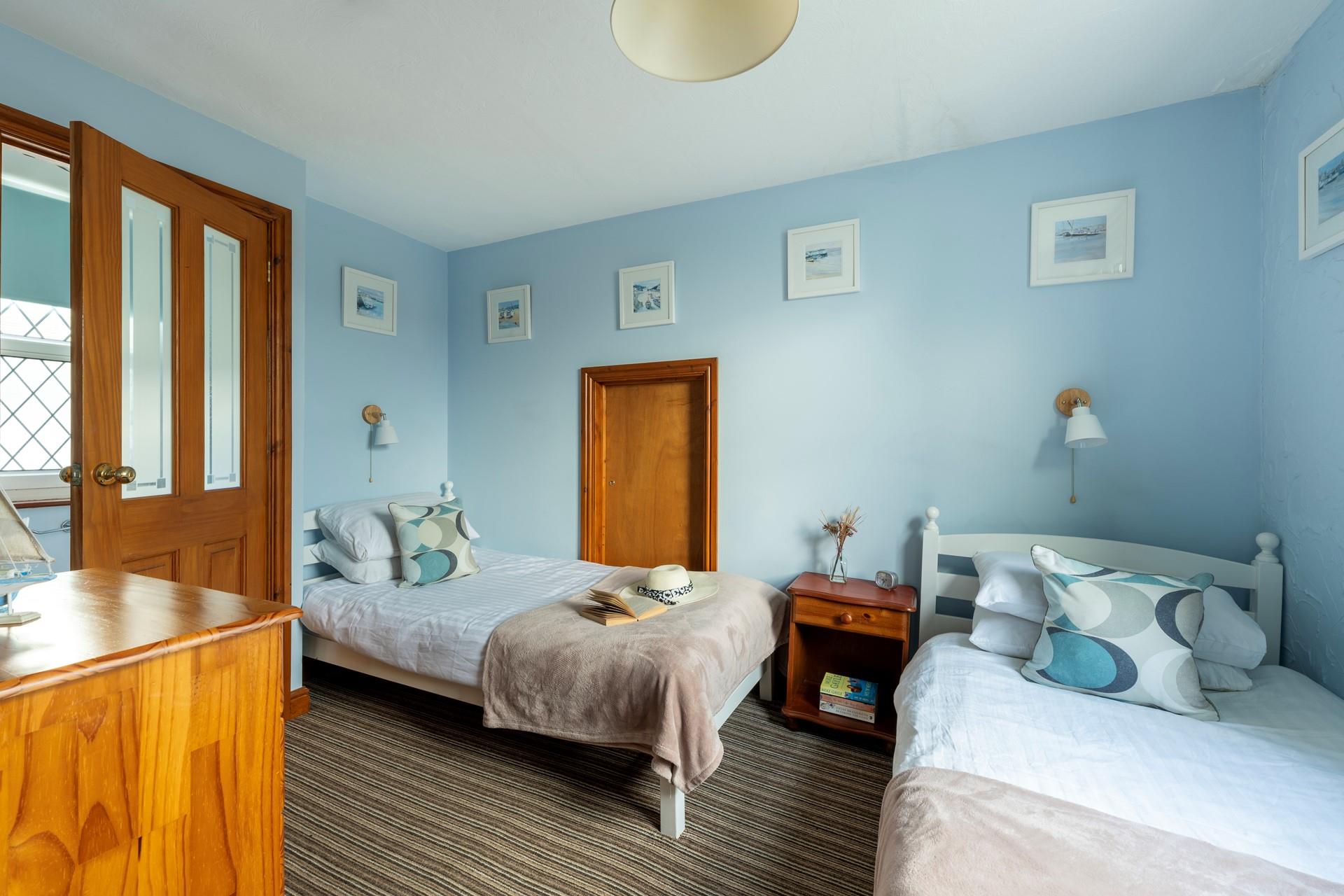 Bedroom 3 is at the top of the property. It has twin beds and has views towards Clodgy Point.