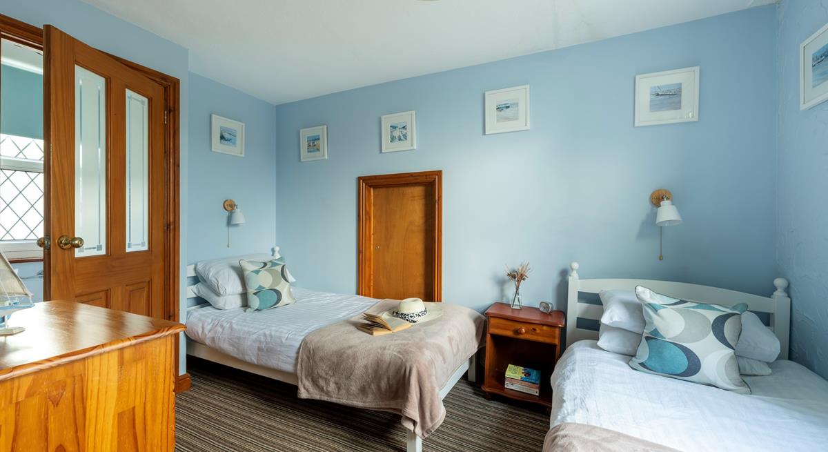 Bedroom 3 is at the top of the property. It has twin beds and has views towards Clodgy Point.