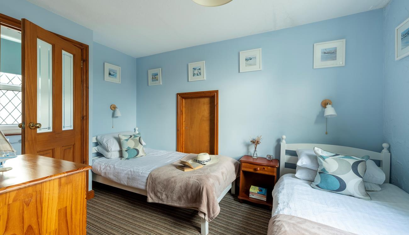 Bedroom 3 is at the top of the property. It has twin beds and has views towards Clodgy Point.